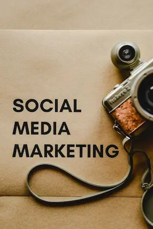 Camera on paper that says social media marketing